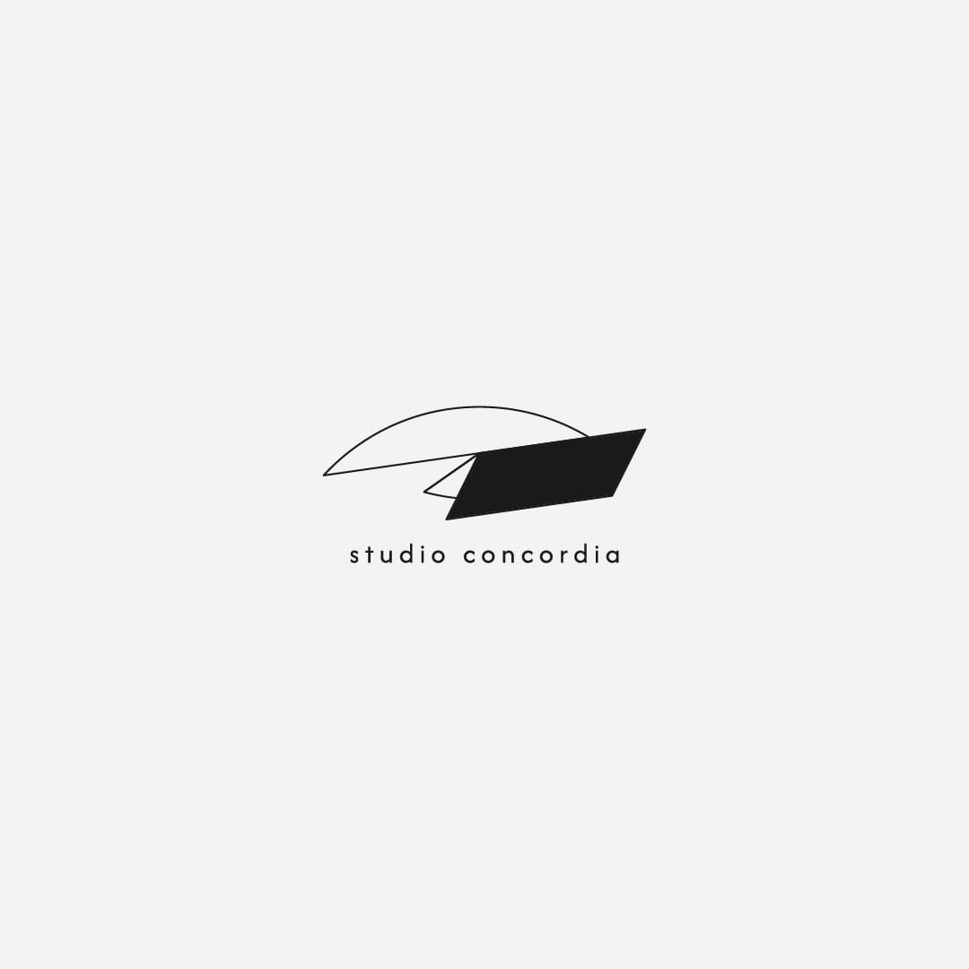 Minimalist logo with a black rectangle overlaid on an arc shape. Studio Concordia is written below in a clean, modern font.